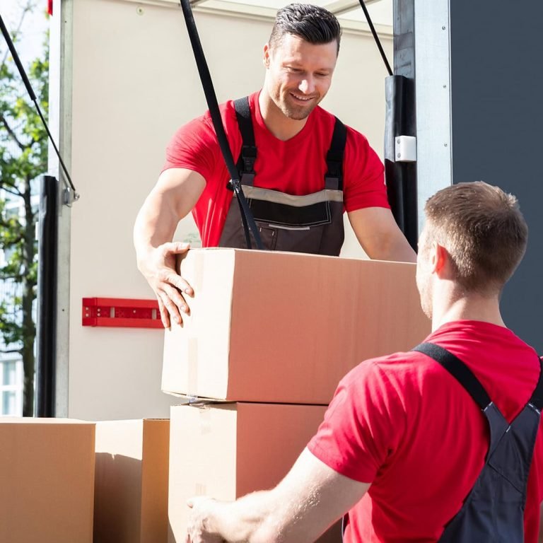 back-two-removal-company-workers-unloading-boxes-furniture-from-minibus2
